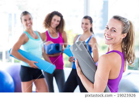Portrait of a cheerful woman in fitness studio Portrait of a cheerful woman in fitness studio 19023926