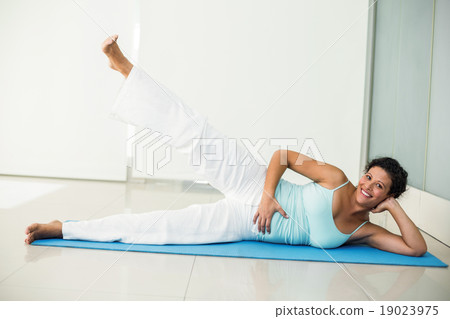 Happy pregnant woman exercising at home 19023975