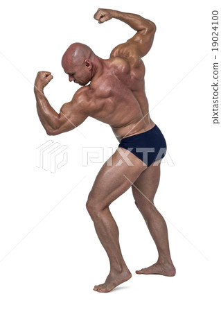 Powerful bald man flexing muscles Powerful bald man flexing muscles 19024100
