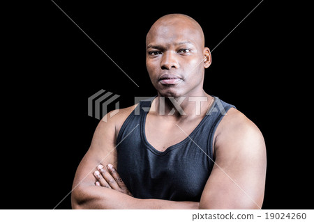 Portrait of bald bodybuilder with arms crossed Portrait of bald bodybuilder with arms crossed 19024260
