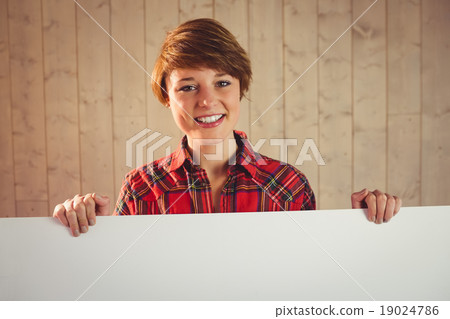 Pretty young woman holding sign Pretty young woman holding sign 19024786
