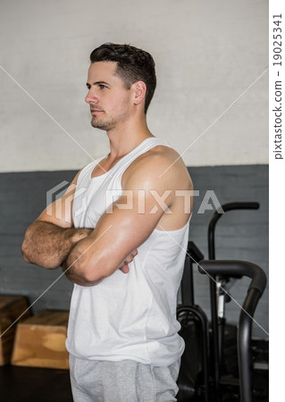 Handsome man posing with arms crossed Handsome man posing with arms crossed 19025341
