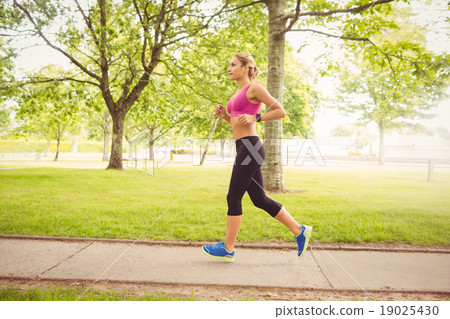 Side view of woman jogging Side view of woman jogging 19025430