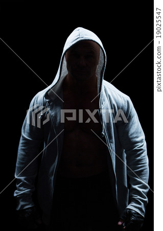 Portrait of confident man in hood Portrait of confident man in hood 19025547