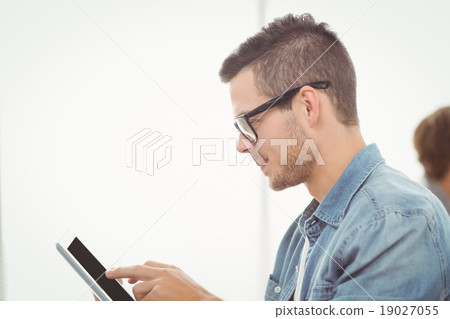 Man with eyeglasses using digital tablet 19027055