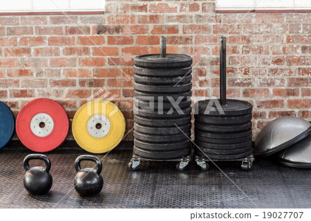 kettlebells in front of weights and bossu 19027707