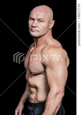 Portrait of shirtless bald man 19027734