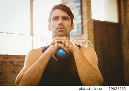 Man holding medicine ball 19028363
