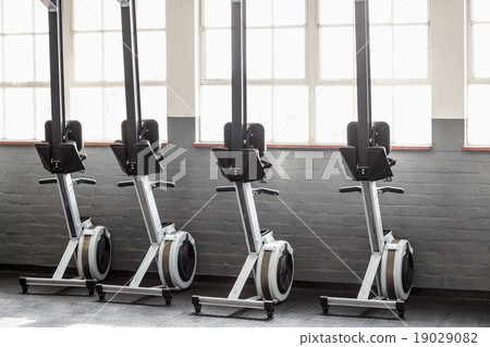 Four exercise bikes near each others Four exercise bikes near each others 19029082