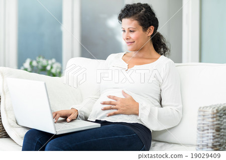 Happy woman using laptop Happy woman using laptop 19029409