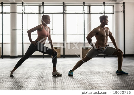 Two fit people doing fitness Two fit people doing fitness 19030756