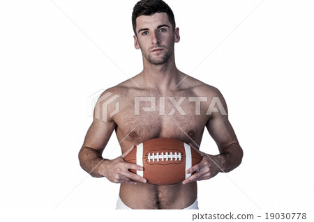 Portrait of shirtless rugby player with the ball 19030778