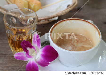 Hot latte coffee and hot tea with toast. 19033297