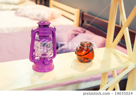 Well decorated hotel bedroom in soft lights 19035024