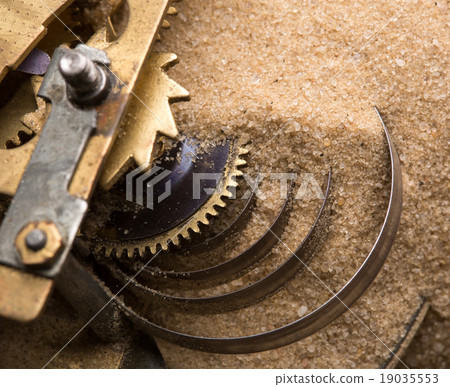 Clock gears in sand 19035553