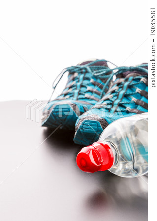Sports runners and a bottle of water Sports runners and a bottle of water 19035581