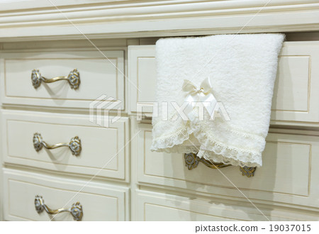 White chest of drawers with a towel White chest of drawers with a towel 19037015