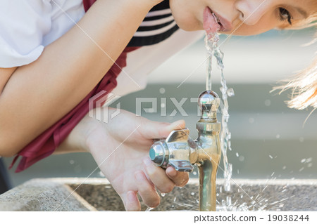 Girls drinking water Girls drinking water 19038244