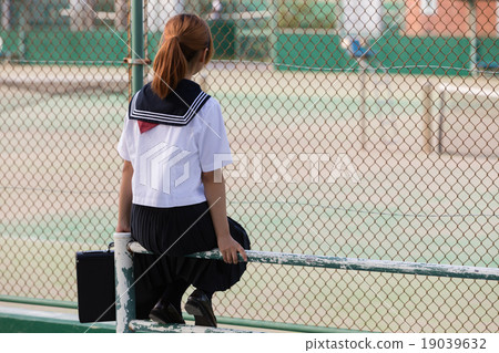Female student and tennis court 19039632