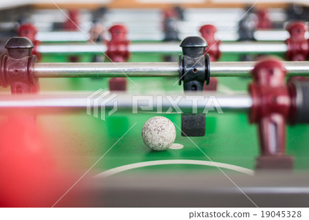 Close up of a foosball game with soccer ball 19045328