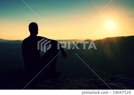 Tourist take rest. Handsome young man sit on rock 19047520