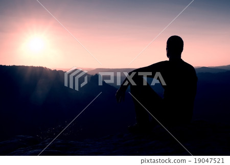 Tourist take a rest. Handsome young man on rock 19047521
