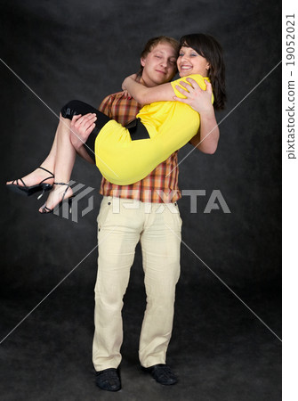 Man holds the girlfriend on hands Man holds the girlfriend on hands 19052021