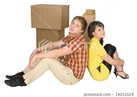 Guy and the girl sit near boxes Guy and the girl sit near boxes 19052029
