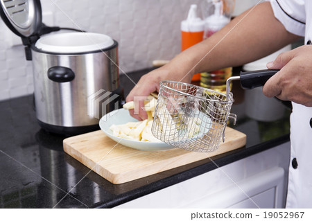 Chef prepared potato for deep fried 19052967