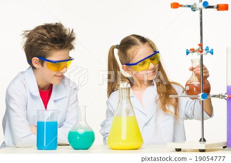 Two cute children at chemistry lesson making 19054777