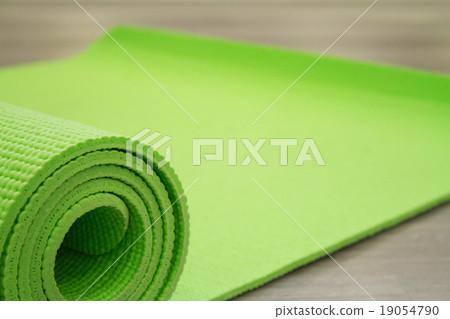 Yoga mat on wooden floor 19054790