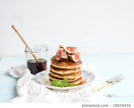 Pancake tower with fresh figs and honey on a Pancake tower with fresh figs and honey on a 19058456