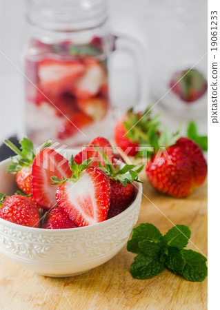 Fresh ripe red strawberries in white bowl 19061233