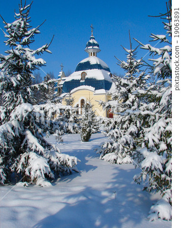 Winter snowy landscape with fur-trees and church 19063891