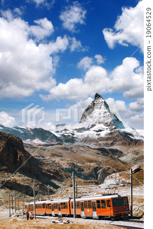 Matterhorn peak with a train in Swiss Alps Matterhorn peak with a train in Swiss Alps 19064529