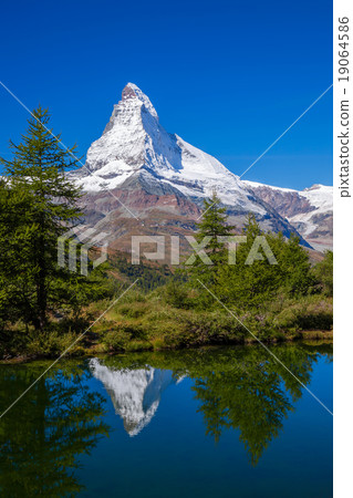 Matterhorn reflecting in Grindjisee in Swiss Alps Matterhorn reflecting in Grindjisee in Swiss Alps 19064586