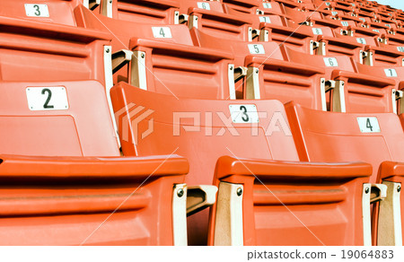 Empty red seating in sport stadium 19064883