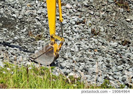 excavator shovel digging rock on constriction site excavator shovel digging rock on constriction site 19064964