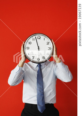 Man with wall clock Man with wall clock 19067139