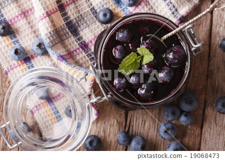 homemade blueberry jam in a glass jar close up 19068473