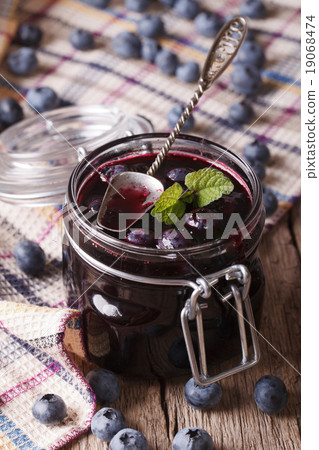 homemade blueberry jam in a glass jar close up 19068474