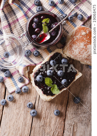 homemade blueberry jam and sweet bun close-up 19068475