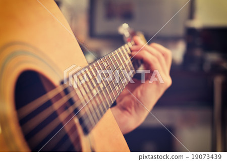 Guitarist Playing On Acoustic Guitar Guitarist Playing On Acoustic Guitar 19073439