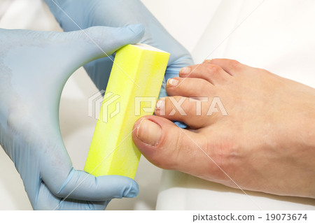 process of pedicure at beauty salon 19073674