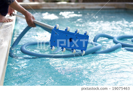 Man holding an equipment cleaning swimming pool Man holding an equipment cleaning swimming pool 19075463