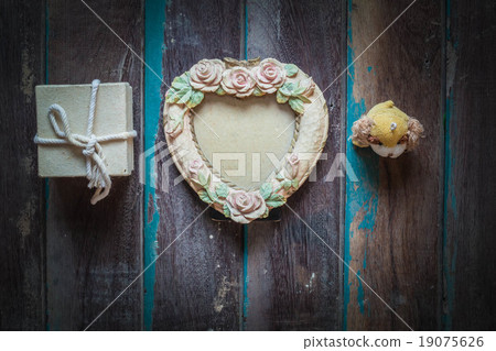 Festival gift on a wooden floor. Festival gift on a wooden floor. 19075626