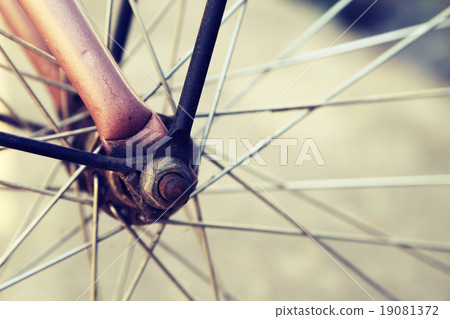 Close up of bicycle wheels in vintage retro style. Close up of bicycle wheels in vintage retro style. 19081372