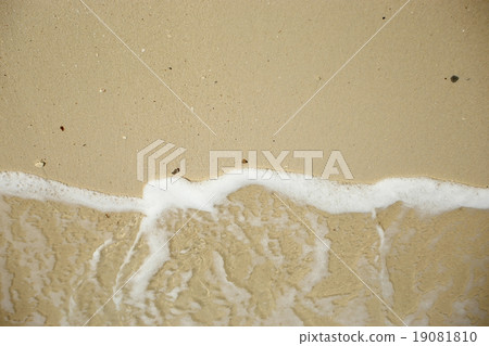 Wave washing up onto sand beach. Wave washing up onto sand beach. 19081810