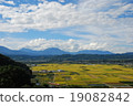 Nagano Electric Railroad car going through the autumn nobutsu rice field (Nakano city, Nagano prefecture) 19082842