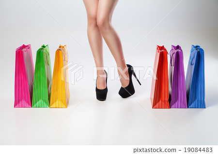 Female thin legs with colored bags Female thin legs with colored bags 19084483